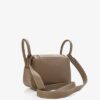 1001915A_400x_9c47edcb-5fcc-4c28-853d-1159cdd23757.jpg Hermès Mini Lindy 20 in Etoupe Taurillon Clemence with Gold Hardware bag