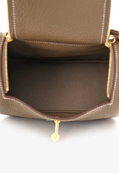 1001915C_400x_6db539b0-e329-4919-bb1c-e36e506dbd05.jpg Hermès Mini Lindy 20 in Etoupe Taurillon Clemence with Gold Hardware bag