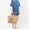 16763011_33135385_1000.jpg Prada logo-embroidered raffia tote bag