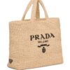 16763011_33136498_1000_f2decf03-ea70-42cd-bdc6-776f71e0633a.jpg Prada logo-embroidered raffia tote bag