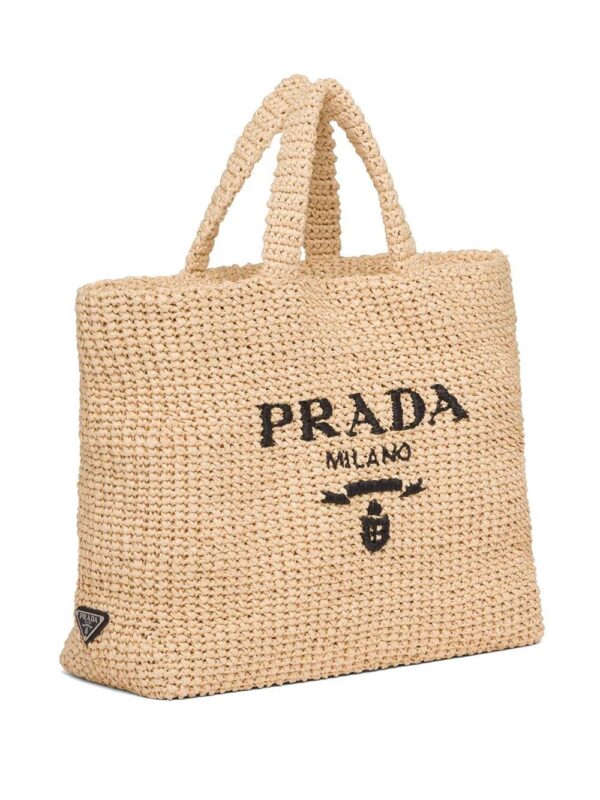 16763011_33136498_1000_f2decf03-ea70-42cd-bdc6-776f71e0633a.jpg Prada logo-embroidered raffia tote bag