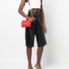 18070799_40302772_1000.jpg Love Moschino logo-lettering quilted crossbody bag