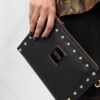 18457534_39675398_1000.jpg Versace logo-plaque studded crossbody bag