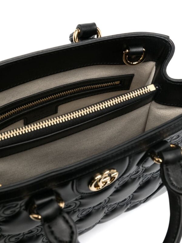 19456256_53167173_1000.jpg Gucci small GG matelassé top-handle bag