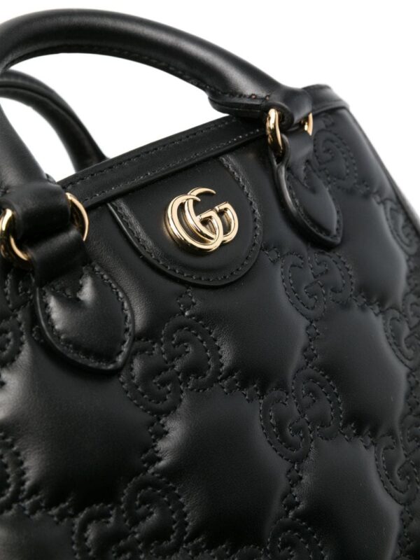 19456256_53167197_1000.jpg Gucci small GG matelassé top-handle bag