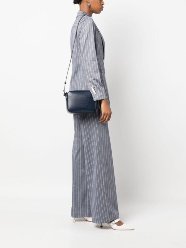 20162766_50127155_1000.jpg Emporio Armani perforated-logo crossbody bag