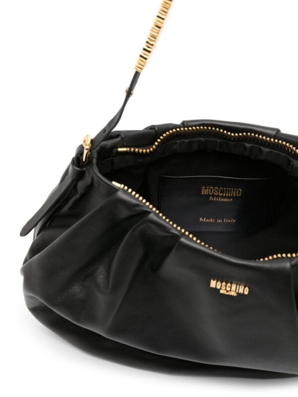 20274472_52002721_1000.jpg Moschino logo-appliqué leather shoulder bag