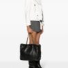 20274488_52020577_1000.jpg Moschino logo-appliqué leather bucket bag