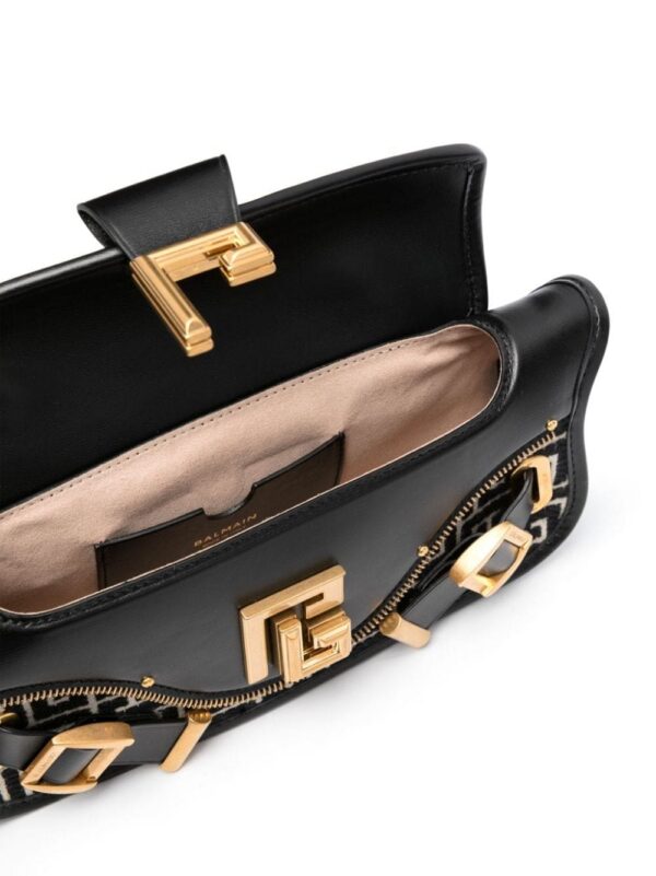 20989359_51070356_1000.jpg Balmain Blaze monogram-jacquard leather clutch bag