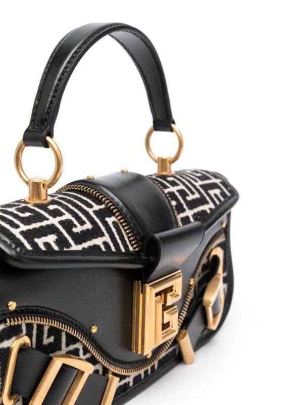 20989359_51070358_1000.jpg Balmain Blaze monogram-jacquard leather clutch bag