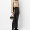 20989359_51070371_1000.jpg Balmain Blaze monogram-jacquard leather clutch bag