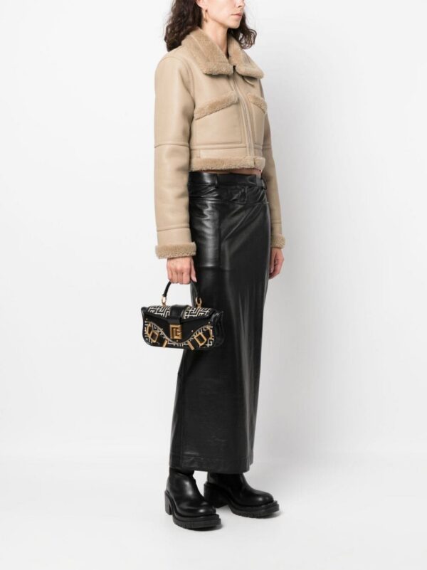 20989359_51070371_1000.jpg Balmain Blaze monogram-jacquard leather clutch bag