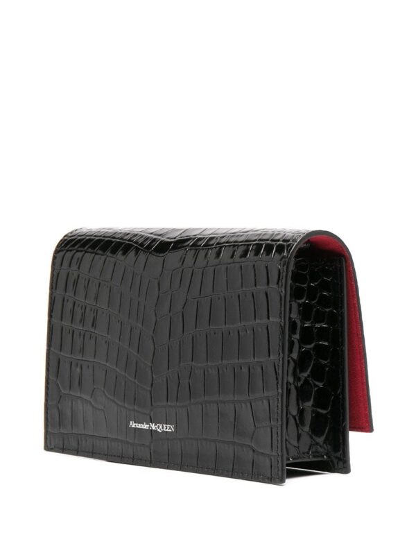 16069542_30135501_1000.jpg Alexander McQueen skull-embellished clutch bag