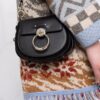 18006117_38112115_1000.jpg Chloé Tess ring-embellished shoulder bag