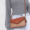 18430027_39520838_1000.jpg Coach monogram-pattern crossbody bag