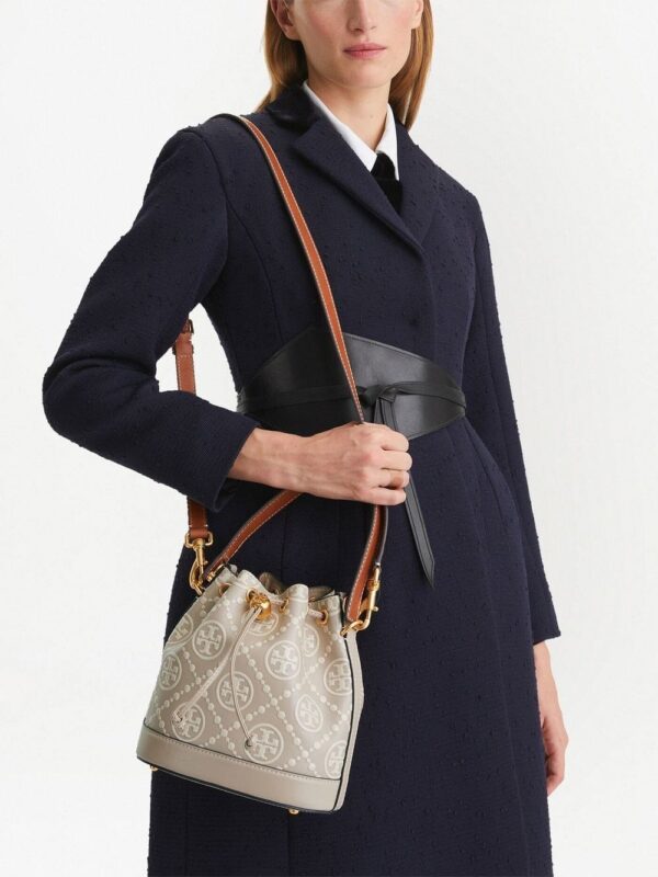 19447949_43785162_1000.jpg Tory Burch monogram-embossed bucket bag