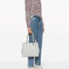 21031290_51595319_1000.jpg Emporio Armani Palmellato logo-charm tote bag