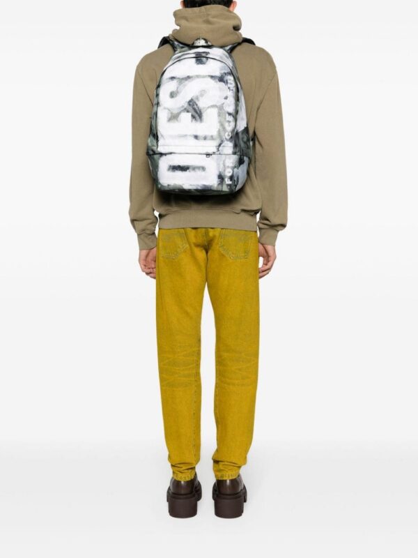 22213727_52185074_1000_85f21d9d-f706-40b3-94b6-a20a1380fb35.jpg Diesel Rave X camouflage-print backpack