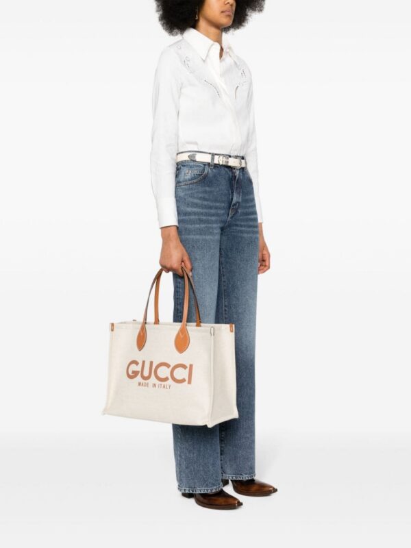 22695722_53366559_1000.jpg Gucci logo-print canvas tote bag