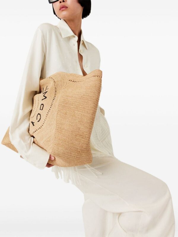 23376395_53857705_1000.jpg Stella McCartney embroidered-logo raffia tote bag