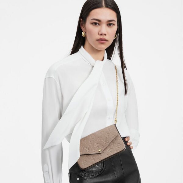 louis-vuitton-felicie-pochette-monogram-empreinte-wallets-and-small-leather-goods-M82609_PM1_Wornview.jpg Louis Vuitton Félicie Pochette