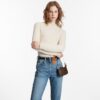 louis-vuitton-mini-pochette-accessoires-monogram-wallets-and-small-leather-goods-M58009_PM1_Wornview.jpg Louis Vuitton Mini Pochette Accessoires