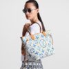 louis-vuitton-neverfull-mm-exclusively-online-other-monogram-canvas-handbags-M11263_PM1_Wornview.jpg Louis Vuitton Neverfull MM