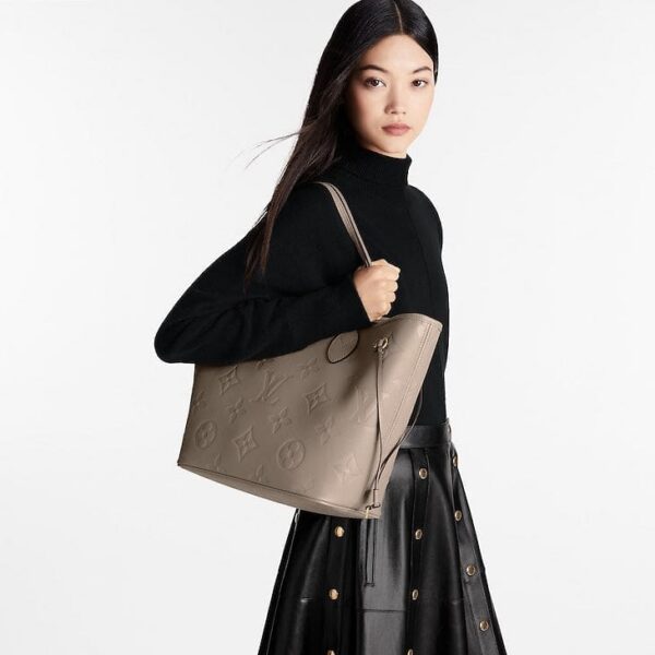 louis-vuitton-neverfull-mm-monogram-empreinte-handbags-M45686_PM1_Wornview.jpg Louis Vuitton Neverfull MM