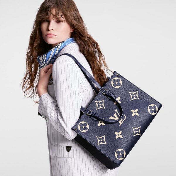 louis-vuitton-onthego-mm-bicolor-monogram-empreinte-leather-handbags-M47084_PM1_Croppedwornview_935c32d4-9bc0-44de-98da-70193326e129.jpg Louis Vuitton Onthego PM