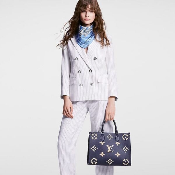 louis-vuitton-onthego-mm-bicolor-monogram-empreinte-leather-handbags-M47084_PM1_Wornview.jpg Louis Vuitton OnTheGo MM
