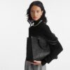 louis-vuitton-onthego-mm-monogram-empreinte-handbags-M45595_PM1_Croppedwornview.jpg Louis Vuitton OnTheGo MM