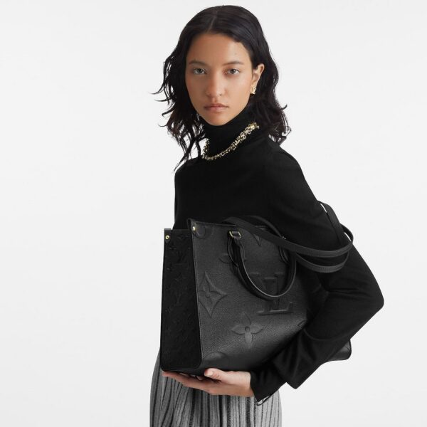 louis-vuitton-onthego-mm-monogram-empreinte-handbags-M45595_PM1_Croppedwornview.jpg Louis Vuitton OnTheGo MM
