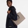 louis-vuitton-onthego-mm-monogram-empreinte-handbags-M45607_PM1_Wornview.jpg Louis Vuitton OnTheGo MM
