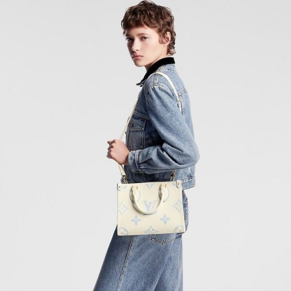 louis-vuitton-onthego-pm-bicolor-monogram-empreinte-leather-handbags-M46833_PM1_Croppedwornview.jpg Louis Vuitton Onthego PM