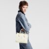 louis-vuitton-onthego-pm-bicolor-monogram-empreinte-leather-handbags-M46833_PM1_Wornview.jpg Louis Vuitton Onthego PM