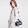 louis-vuitton-speedy-bandouliere-20-bicolor-monogram-empreinte-leather-handbags-M47048_PM1_Wornview.jpg Louis Vuitton Speedy Bandoulière 20