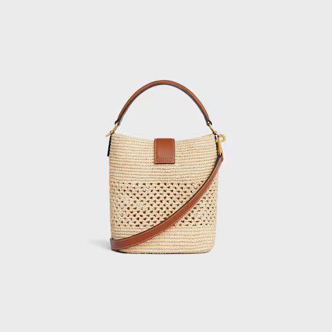 119742GNS-02NT_4_SUM25_W_d3b2030a-b00d-4cd6-9ced-0fbb6747887c.jpg CELINE SMALL LOUISE BUCKET IN RAFFIA AND CALFSKIN
