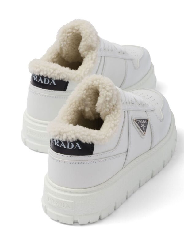 Prada triangle-plaque low-top sneakers