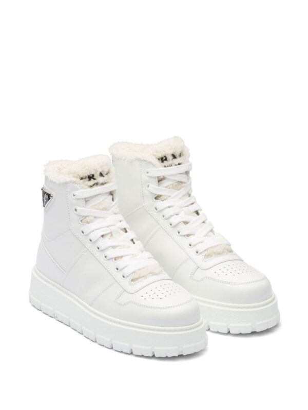 19003727_41361204_1000_800ceecc-d4f0-4ade-81bf-b42f370d1a5a.jpg Prada logo-plaque high-top sneakers