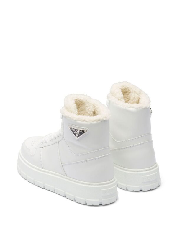 19003727_41361207_1000_95a2484e-9b21-4169-8bb0-ad9ab9d521c1.jpg Prada logo-plaque high-top sneakers