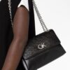 20259770_50467677_1000.jpg Calvin Klein Re-Lock embossed crossbody bag