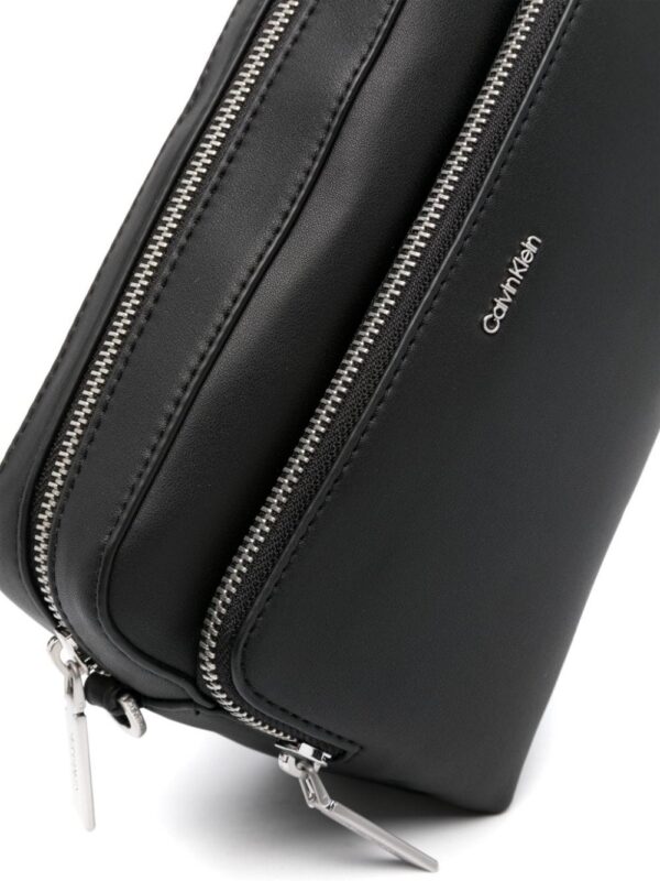 22290799_52202599_1000.jpg Calvin Klein logo-lettering leather crossbody bag