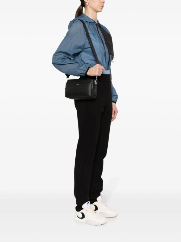 22290799_52202601_1000.jpg Calvin Klein logo-lettering leather crossbody bag