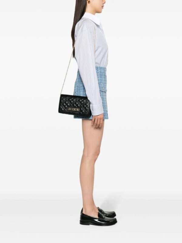 22364784_52296494_1000.jpg Love Moschino logo-lettering quilted crossbody bag