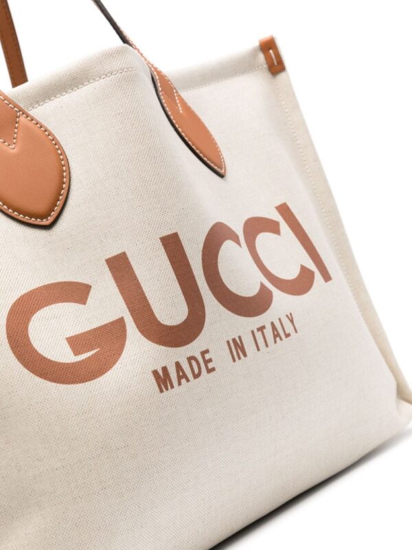 22695722_53366542_1000.jpg Gucci logo-print canvas tote bag