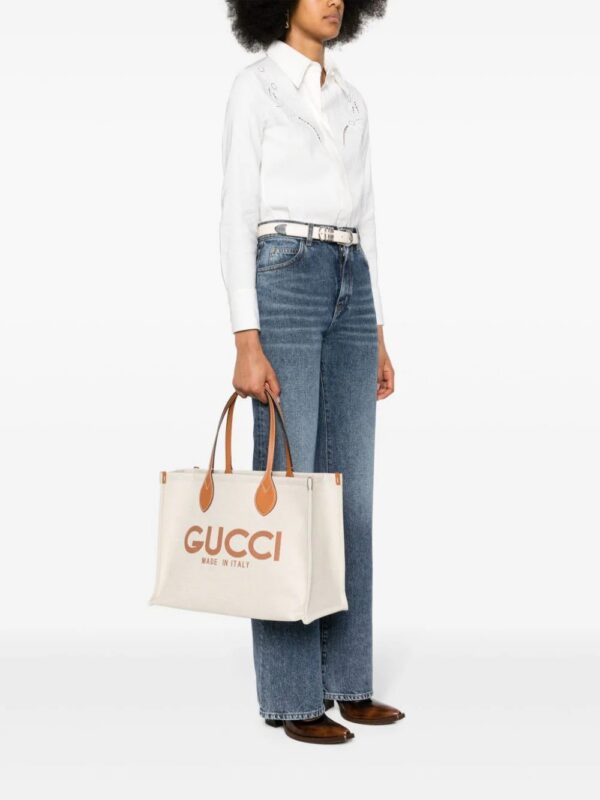 22695722_53366559_1000.jpg Gucci logo-print canvas tote bag