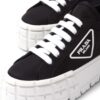 23558432_53524454_1000_2597710a-246d-4af7-ac76-38cc1aadf6a0.jpg Prada Double Wheel low-top sneakers