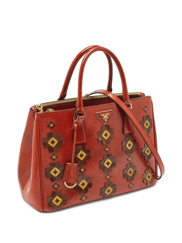 31329600_60887299_1000.jpg Prada flower-detailing leather tote bag