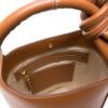 22240970_52513279_1000.jpg Jacquemus Le Petit Tourni leather bucket bag