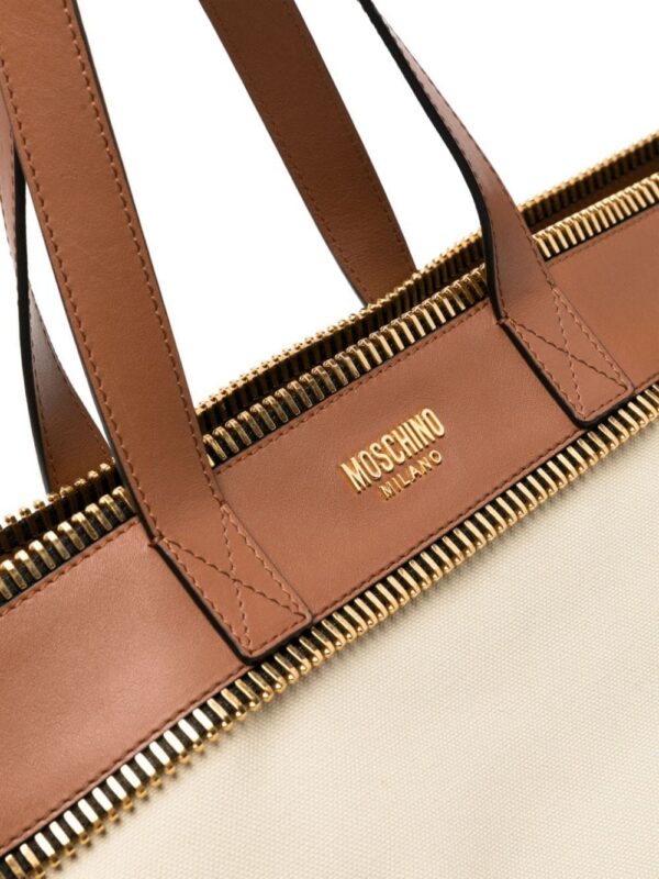 22301436_52182764_1000.jpg Moschino logo-lettering canvas shoulder bag